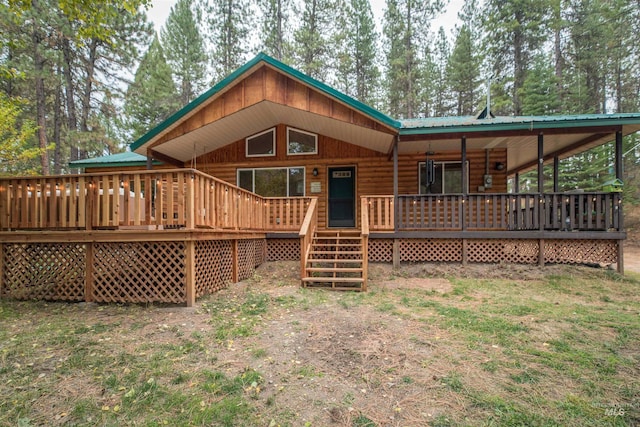 back of house with metal roof