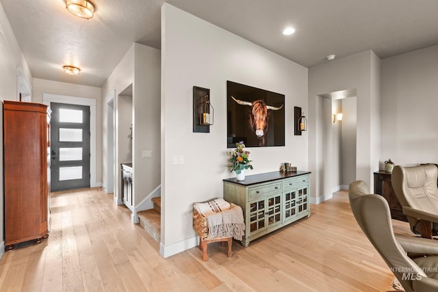 entryway with light hardwood / wood-style flooring