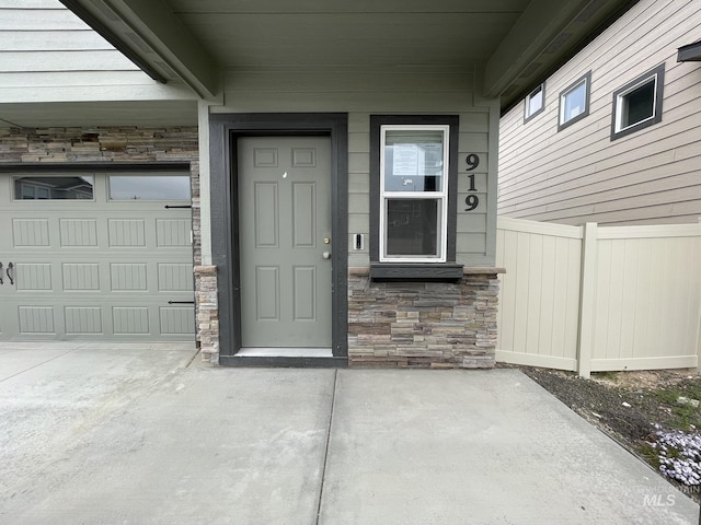 view of exterior entry with stone siding