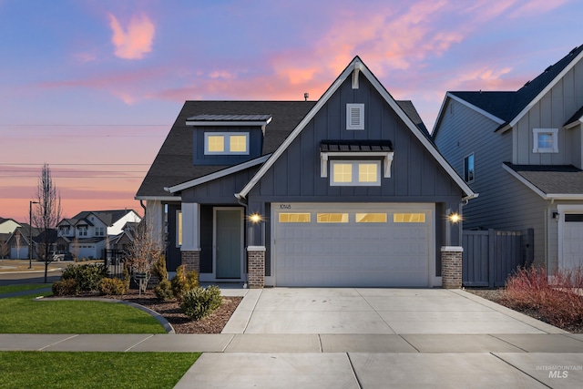 view of front facade featuring driveway, fence, board and batten siding, and brick siding