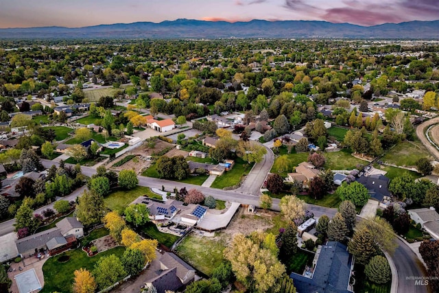 aerial view at dusk of a mountain view and a residential view