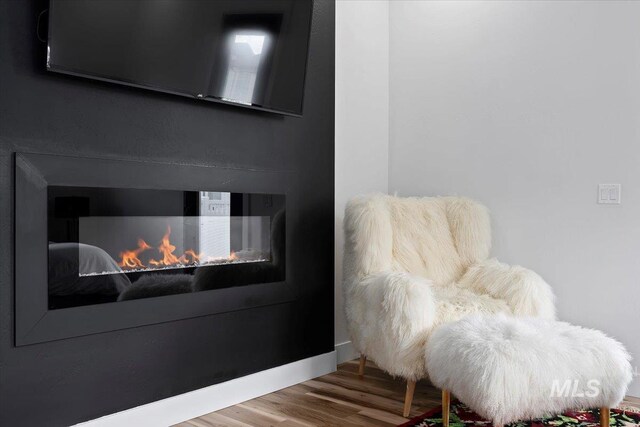 sitting room featuring wood finished floors
