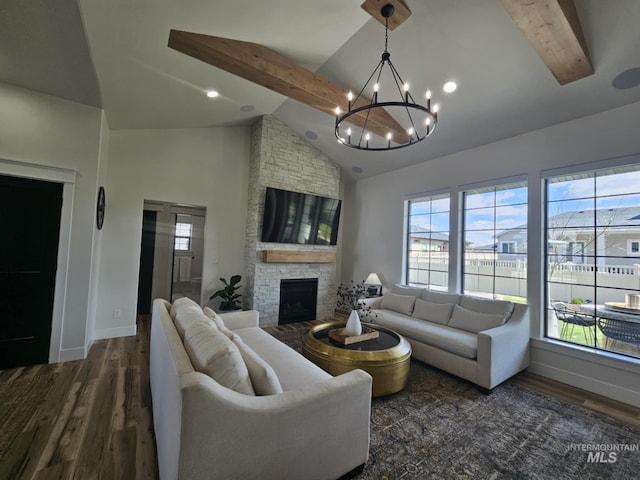 living area featuring beamed ceiling, high vaulted ceiling, a chandelier, wood finished floors, and baseboards