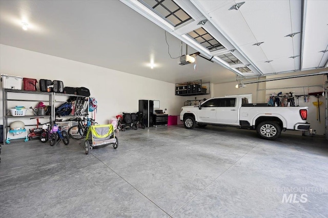 garage featuring a garage door opener