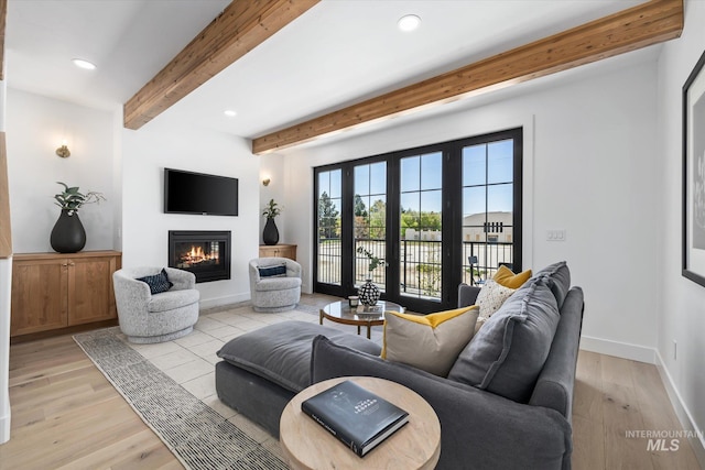 living room with beam ceiling, french doors, and light wood-type flooring