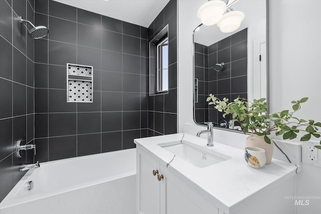 bathroom with vanity and tiled shower / bath