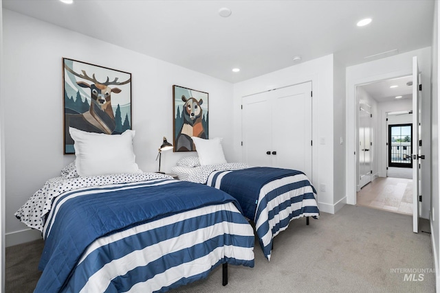 carpeted bedroom featuring a closet