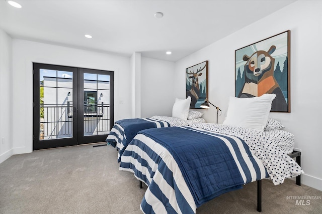 bedroom with access to exterior, french doors, and carpet floors