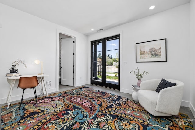 living area featuring french doors