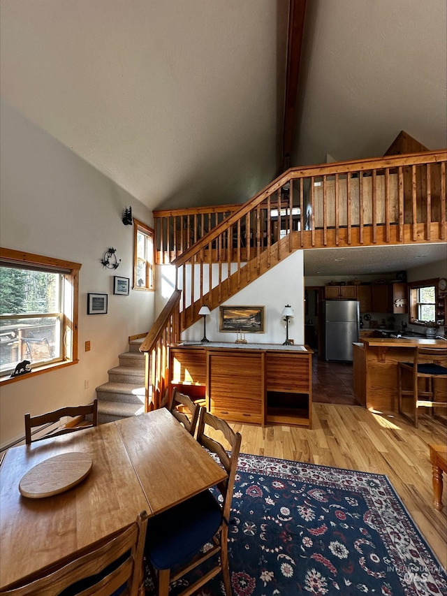 95 Valley Way, Stanley, ID 83278 - dining area with high vaulted ceiling, stairway, light wood-type flooring, and beamed ceiling
