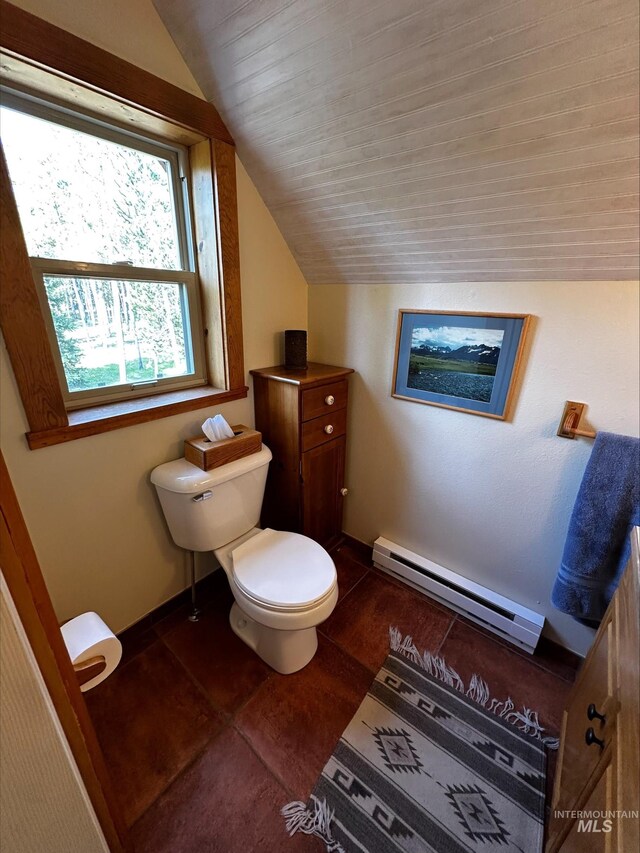 95 Valley Way, Stanley, ID 83278 - half bathroom with baseboard heating, vaulted ceiling, toilet, and baseboards