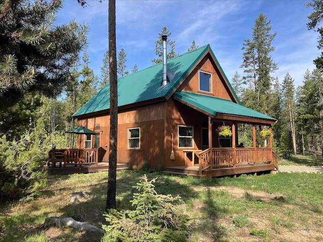 95 Valley Way, Stanley, ID 83278 - back of house featuring a deck, metal roof, and a lawn