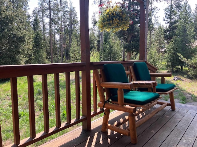 95 Valley Way, Stanley, ID 83278 - wooden terrace with a wooded view