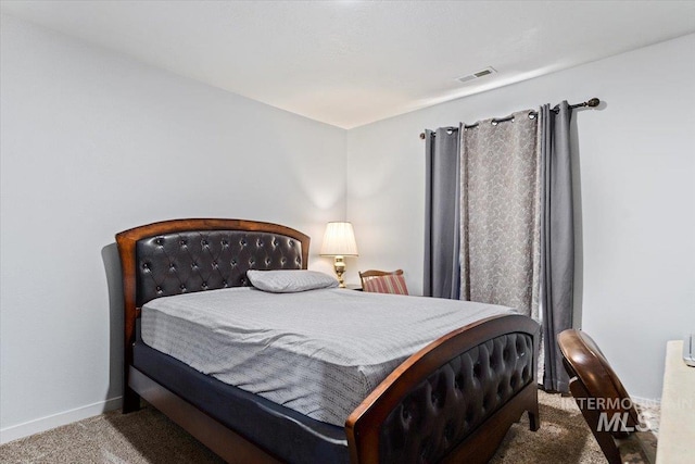 carpeted bedroom with baseboards and visible vents