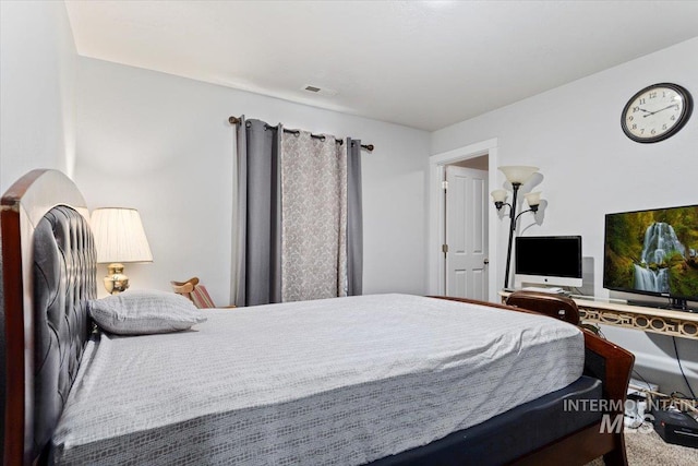 bedroom featuring visible vents