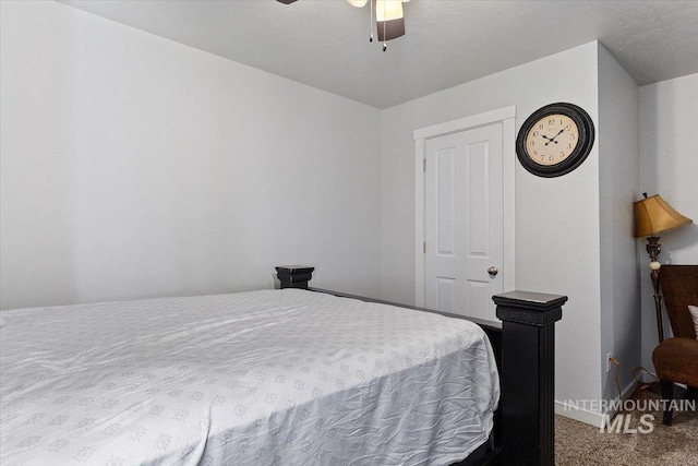 bedroom with baseboards, ceiling fan, and carpet flooring