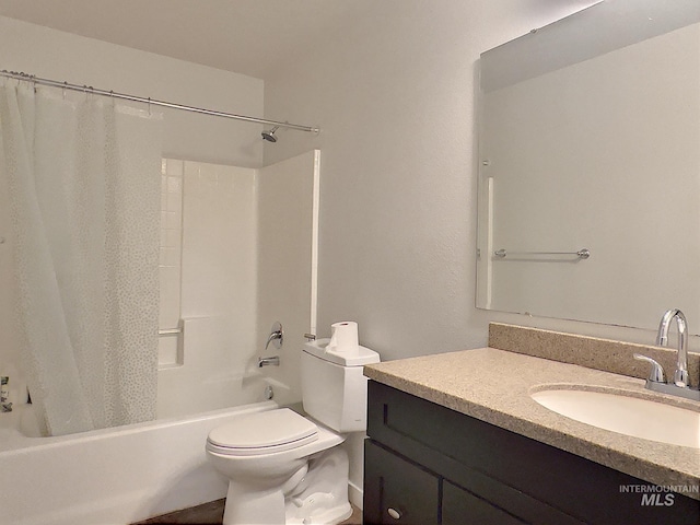 full bathroom featuring toilet, vanity, and shower / bathtub combination with curtain