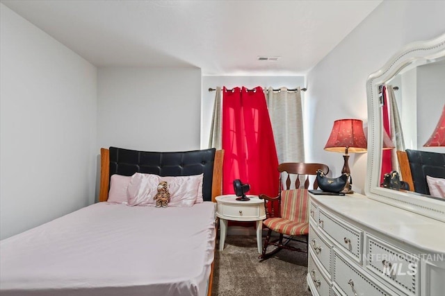 bedroom with carpet and visible vents