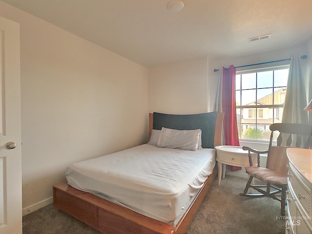 bedroom with dark carpet