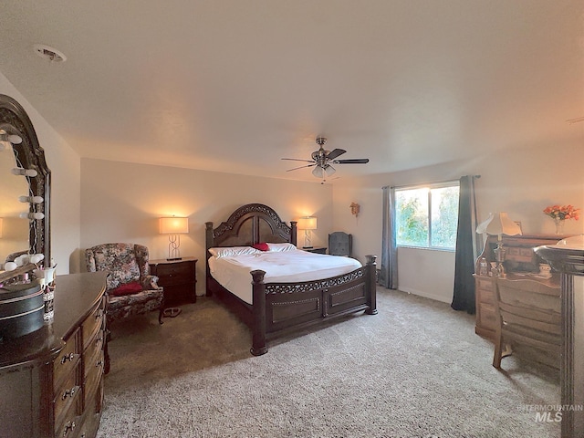 bedroom with dark carpet and ceiling fan