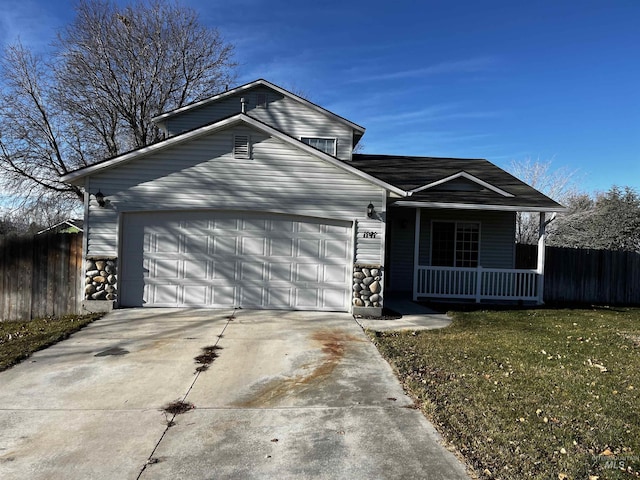 view of front facade with a front lawn, a garage, and covered porch