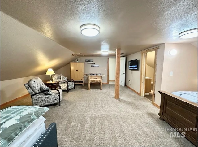 carpeted bedroom featuring lofted ceiling and a textured ceiling