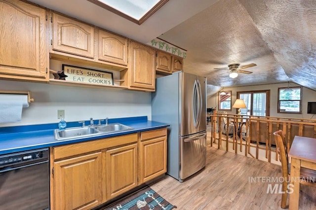 kitchen with dishwasher, sink, ceiling fan, stainless steel fridge, and a textured ceiling