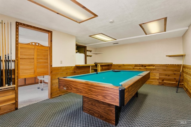 playroom featuring dark colored carpet, wooden walls, and pool table