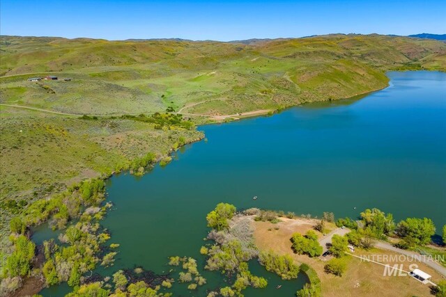 bird's eye view of a water and mountain view