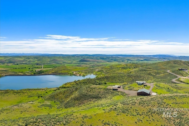 drone / aerial view of a water and mountain view