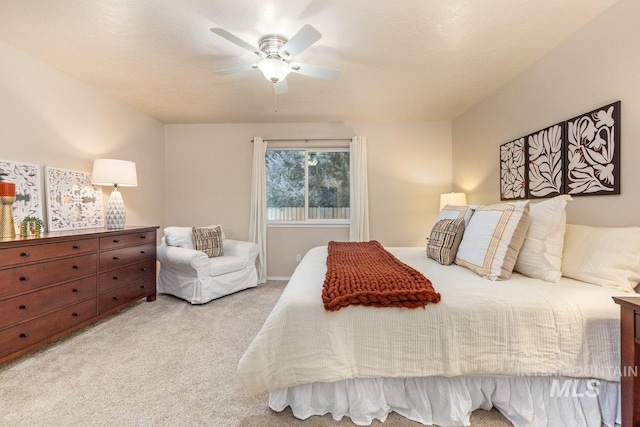 bedroom featuring light carpet and ceiling fan