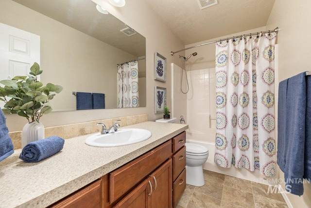 full bathroom featuring vanity, a textured ceiling, toilet, and shower / bath combo