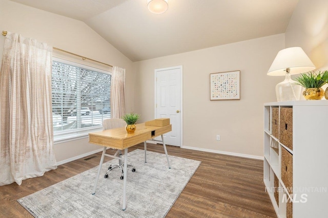 home office with vaulted ceiling and dark wood-type flooring