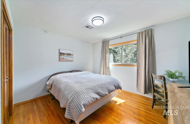 14 Cougar Ln, Boise, ID 83716 - bedroom featuring wood finished floors, baseboards, and a closet