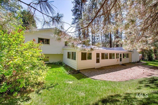 14 Cougar Ln, Boise, ID 83716 - rear view of property with a lawn