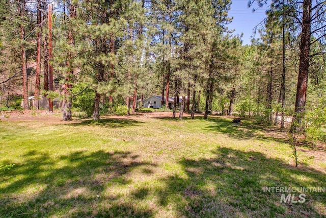 14 Cougar Ln, Boise, ID 83716 - view of green lawn featuring a view of trees
