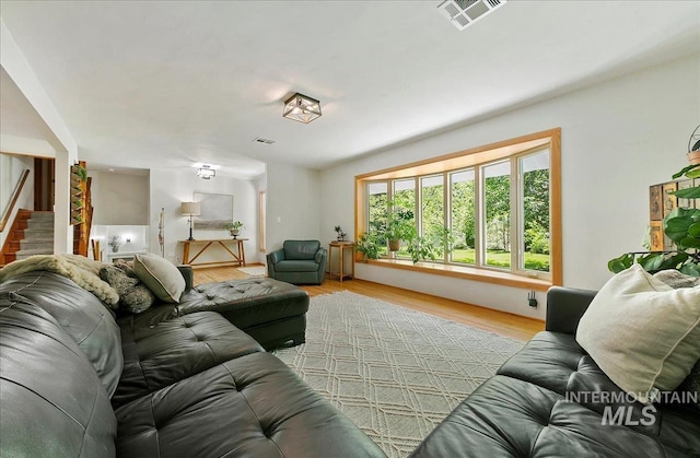 14 Cougar Ln, Boise, ID 83716 - living room featuring light wood-style flooring and stairway