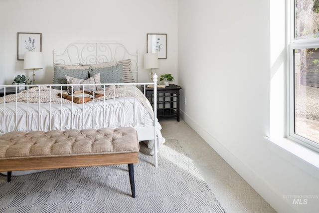 carpeted bedroom with baseboards