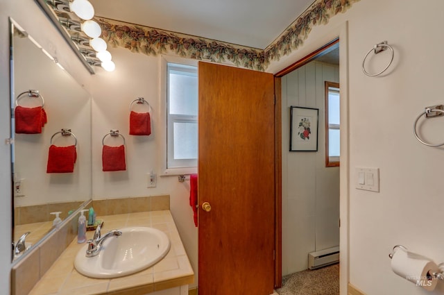 bathroom with vanity and a baseboard radiator