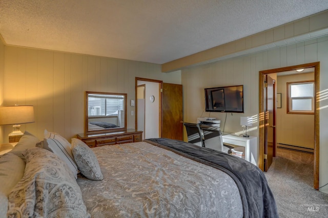 carpeted bedroom featuring a textured ceiling and baseboard heating