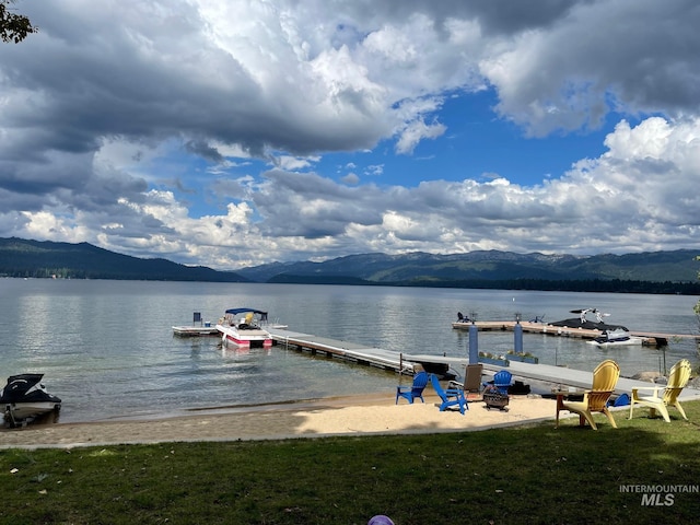 dock area featuring a water and mountain view