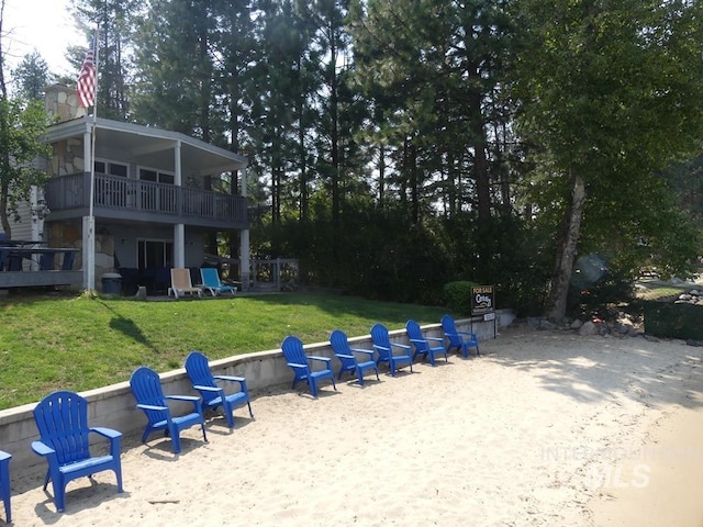 view of yard featuring an outdoor fire pit and a patio area