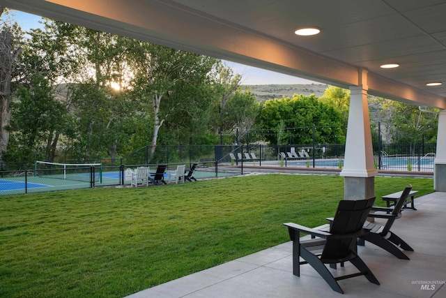 view of yard featuring tennis court