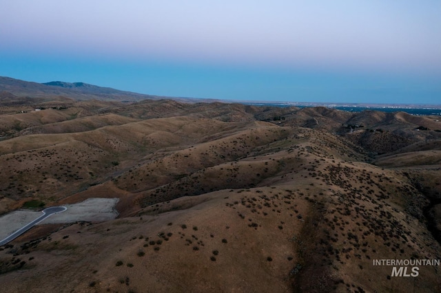 aerial view at dusk with a mountain view