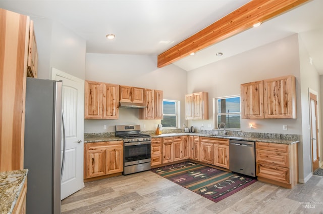 1190 Devils Elbow Rd, Weiser, ID 83672 - kitchen featuring appliances with stainless steel finishes, under cabinet range hood, beamed ceiling, light wood-style floors, and light stone countertops