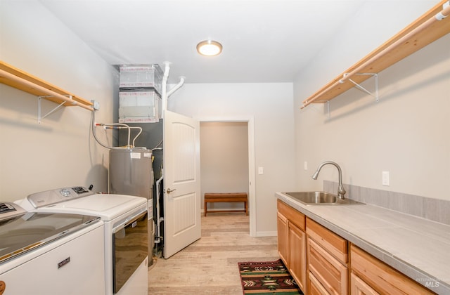 1190 Devils Elbow Rd, Weiser, ID 83672 - laundry room featuring cabinet space, separate washer and dryer, and light wood-type flooring