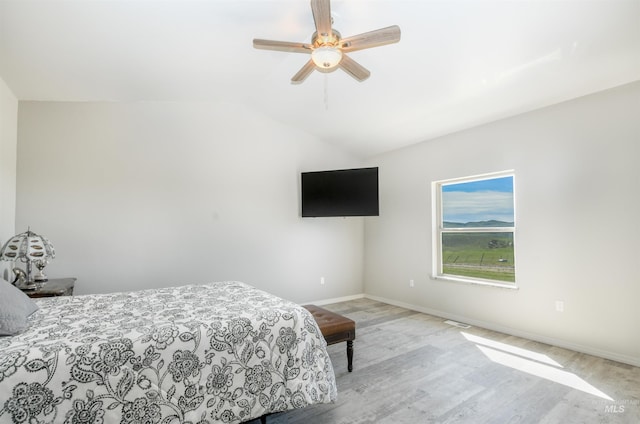 1190 Devils Elbow Rd, Weiser, ID 83672 - bedroom with light wood-style floors, baseboards, lofted ceiling, and ceiling fan