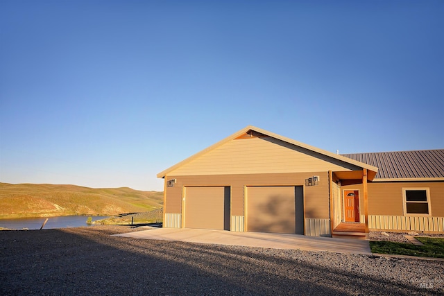 1190 Devils Elbow Rd, Weiser, ID 83672 - ranch-style home with a mountain view, driveway, a garage, and metal roof
