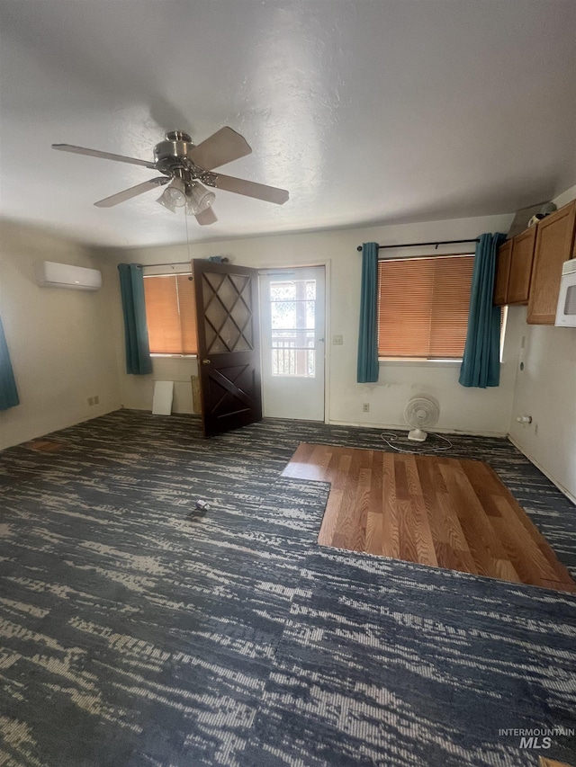 58438 Mansford Ave, Murphy Hot Springs, ID 83302 - unfurnished room featuring ceiling fan, an AC wall unit, and carpet