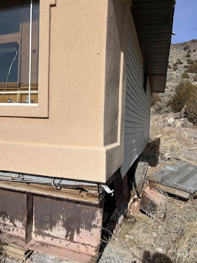 58438 Mansford Ave, Murphy Hot Springs, ID 83302 - view of side of home featuring stucco siding